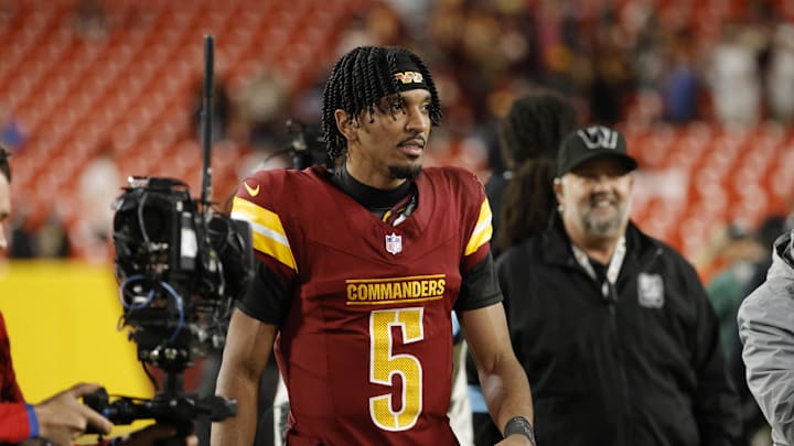 Dec 29, 2024; Landover, Maryland, USA; Washington Commanders quarterback Jayden Daniels (5) looks on while leaving the field after defeating the Atlanta Falcons at Northwest Stadium. Mandatory Credit: Amber Searls-Imagn Images