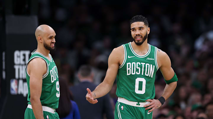Mar 2, 2025; Boston, Massachusetts, USA; Boston Celtics forward Jayson Tatum (0) and Boston Celtics guard Derrick White (9) talk during the second half against the Denver Nuggets at TD Garden. Mandatory Credit: Paul Rutherford-Imagn Images
