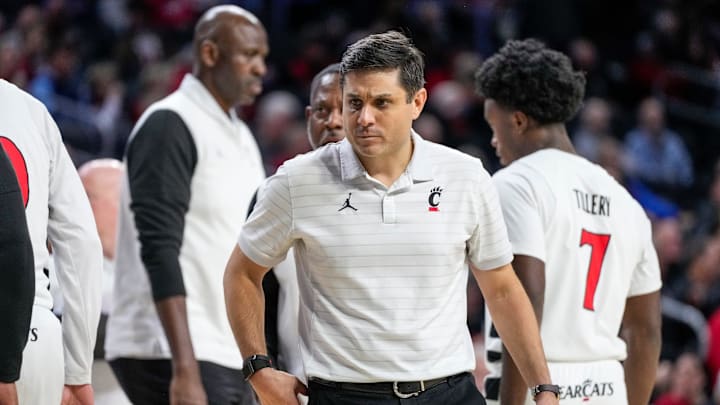 Cincinnati Bearcats head coach Wes Miller walks on the court during a timeout in the second half of the NCAA men’s basketball game between the Cincinnati Bearcats and the Tarleton State Texans at Fifth Third Arena in Cincinnati on Monday, Dec. 1, 2025. The Bearcats won 76-58. Cincinnati Bearcats head coach Wes Miller walks on the court during a timeout in the second half of the NCAA men’s basketball game between the Cincinnati Bearcats and the Tarleton State Texans at Fifth Third Arena in Cincinnati on Monday, Dec. 1, 2025. The Bearcats won 76-58.