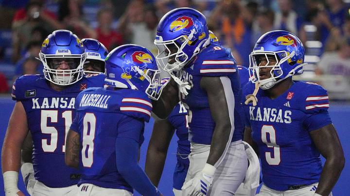 Sep 4, 2026; Lawrence, Kansas, USA; Kansas Jayhawks running back Yasin Willis (6) celebrates with quarterback Isaiah Marshall (8) after scoring against the LIU Sharks during the first half at David Booth Kansas Memorial Stadium. Mandatory Credit: Denny Medley-Imagn Images