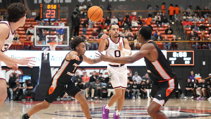 Gonzaga Bulldogs guard Ryan Nembhard (0) passes against Pacific Tigers guard Seth Jones (7) and forward Solomon Ominu (right). 