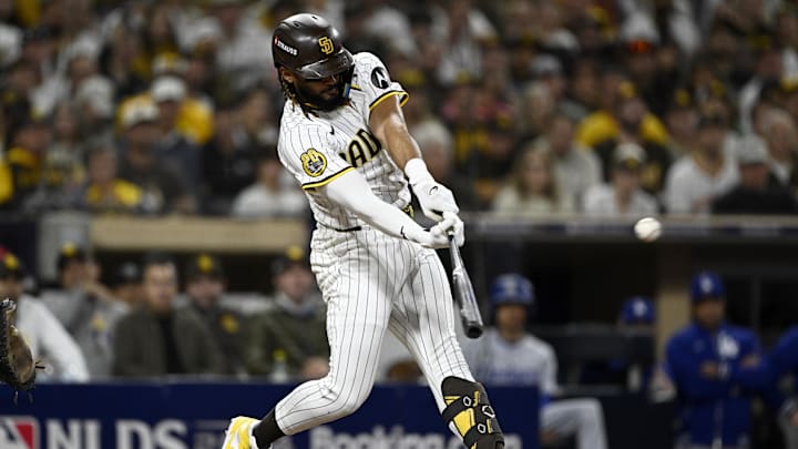 Oct 9, 2024; San Diego, California, USA; San Diego Padres outfielder Fernando Tatis Jr. (23) doubles in the third inning against the Los Angeles Dodgers during game four of the NLDS for the 2024 MLB Playoffs at Petco Park. Mandatory Credit: Denis Poroy-Imagn Images Oct 9, 2024; San Diego, California, USA; San Diego Padres outfielder Fernando Tatis Jr. (23) doubles in the third inning against the Los Angeles Dodgers during game four of the NLDS for the 2024 MLB Playoffs at Petco Park. Mandatory Credit: Denis Poroy-Imagn Images