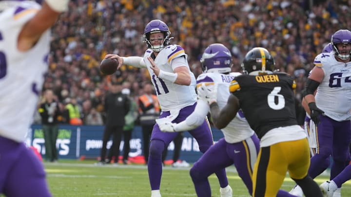 Sep 28, 2025; Dublin, Ireland; Minnesota Vikings quarterback Carson Wentz (11) throws downfield during the fourth quarter against the Pittsburgh Steelers during an NFL International Series game at Croke Park. Mandatory Credit: Kirby Lee-Imagn Images
