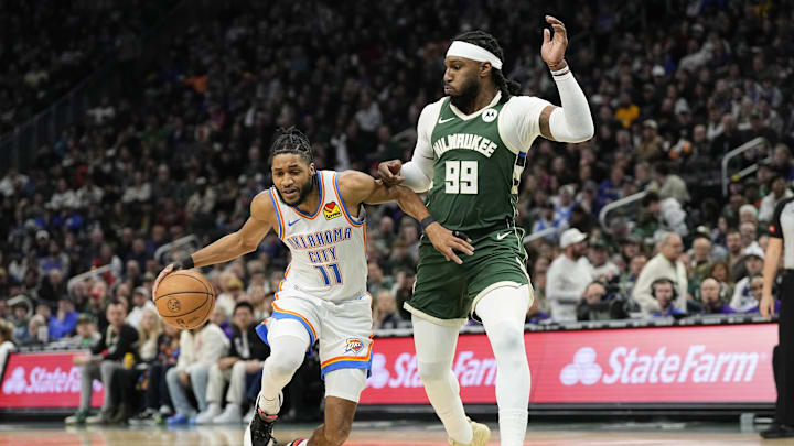 Mar 24, 2024; Milwaukee, Wisconsin, USA;  Oklahoma City Thunder guard Isaiah Joe (11) drives for the