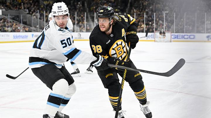 Dec 16, 2025; Boston, Massachusetts, USA; Utah Mammoth defenseman Sean Durzi (50) shields Boston Bruins right wing David Pastrnak (88) from the puck during the third period at TD Garden. Mandatory Credit: Eric Canha-Imagn Images Dec 16, 2025; Boston, Massachusetts, USA; Utah Mammoth defenseman Sean Durzi (50) shields Boston Bruins right wing David Pastrnak (88) from the puck during the third period at TD Garden. Mandatory Credit: Eric Canha-Imagn Images