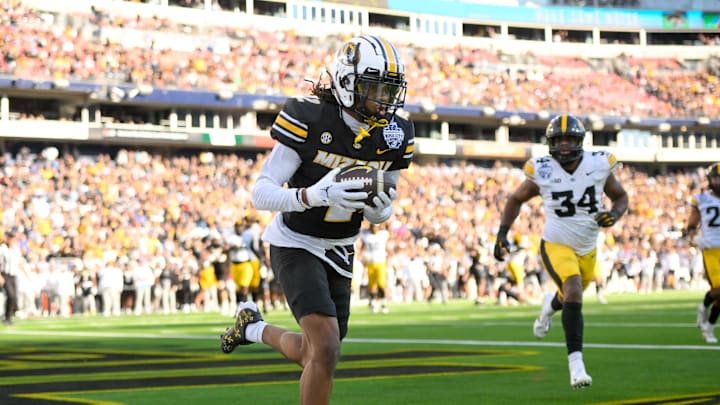 Dec 30, 2024; Nashville, TN, USA; Missouri Tigers wide receiver Marquis Johnson (2) makes a catch for a touchdown against the Iowa Hawkeyes during the first half at Nissan Stadium. Mandatory Credit: Steve Roberts-Imagn Images Dec 30, 2024; Nashville, TN, USA; Missouri Tigers wide receiver Marquis Johnson (2) makes a catch for a touchdown against the Iowa Hawkeyes during the first half at Nissan Stadium. Mandatory Credit: Steve Roberts-Imagn Images