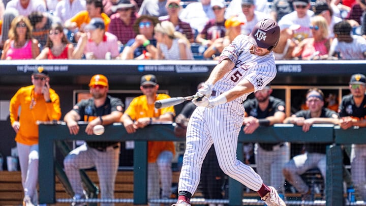 Jun 23, 2024; Omaha, NE, USA; Texas A&M Aggies designated hitter Hayden Schott (5) hits a single against the Tennessee Volunteers during the fourth inning at Charles Schwab Field Omaha. Mandatory Credit: Dylan Widger-USA TODAY Sports