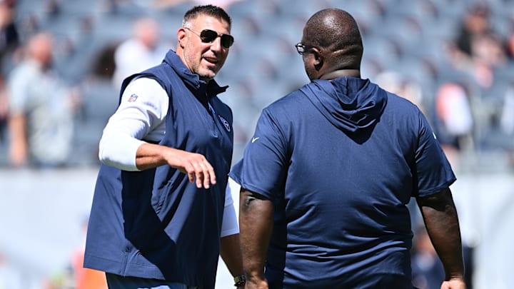 Aug 12, 2023; Chicago, Illinois, USA;  Tennessee Titans Head Coach Mike Vrabel talks with Assistant Head Coach Terrell Williams before a game against the Chicago Bears at Soldier Field. Mandatory Credit: Jamie Sabau-Imagn Images