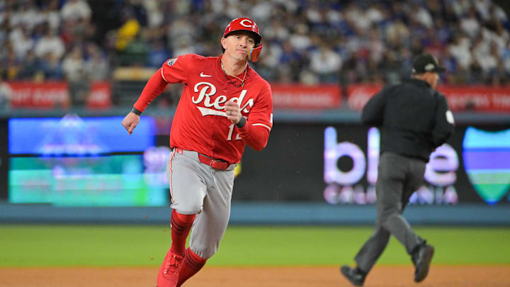 Sep 30, 2025; Los Angeles, California, USA; Cincinnati Reds left fielder Austin Hays (12) advances to third base on a single from Cincinnati Reds first baseman Spencer Steer (7) (not pictured) during the seventh inning against the Los Angeles Dodgers during game one of the Wildcard round for the 2025 MLB playoffs at Dodger Stadium. Mandatory Credit: Jayne Kamin-Oncea-Imagn Images Sep 30, 2025; Los Angeles, California, USA; Cincinnati Reds left fielder Austin Hays (12) advances to third base on a single from Cincinnati Reds first baseman Spencer Steer (7) (not pictured) during the seventh inning against the Los Angeles Dodgers during game one of the Wildcard round for the 2025 MLB playoffs at Dodger Stadium. Mandatory Credit: Jayne Kamin-Oncea-Imagn Images