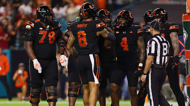 Oct 26, 2024; Miami Gardens, Florida, USA; Miami Hurricanes running back Mark Fletcher Jr. (4) celebrates with teammates after scoring a touchdown against the Florida State Seminoles during the first quarter at Hard Rock Stadium. Mandatory Credit: Sam Navarro-Imagn Images