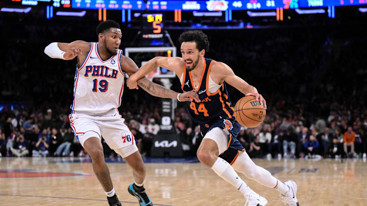 Apr 1, 2025; New York, New York, USA; New York Knicks guard Landry Shamet (44) drives to the basket while being defended by Philadelphia 76ers forward Justin Edwards (19) during the first half at Madison Square Garden. Mandatory Credit: John Jones-Imagn Images