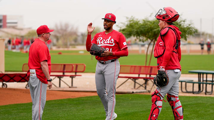 Cincinnati Reds pitching coach/director of pitching Derek Johnson (36) wraps up a bullpen session with pitcher Hunter Greene (21) at the Cincinnati Reds player development complex in Goodyear, Ariz., on Friday, Feb. 13, 2026.