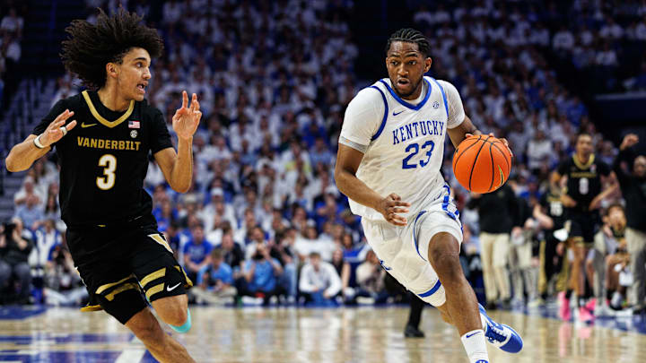 Feb 28, 2026; Lexington, Kentucky, USA; Kentucky Wildcats forward Mouhamed Dioubate (23) brings the ball up court against Vanderbilt Commodores guard Tyler Tanner (3) during the second half at Rupp Arena at Central Bank Center. Mandatory Credit: Jordan Prather-Imagn Images