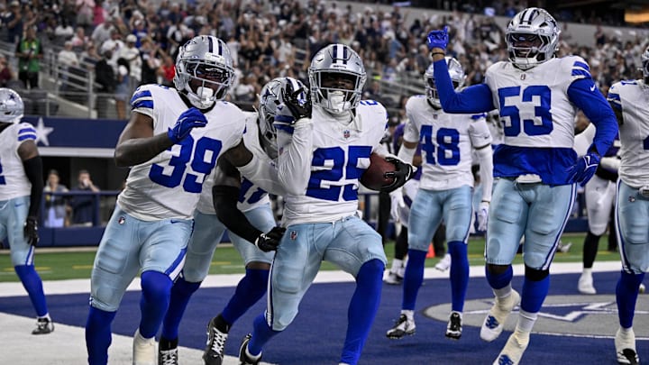 The Dallas Cowboys celebrate a touchdown by cornerback Andrew Booth.