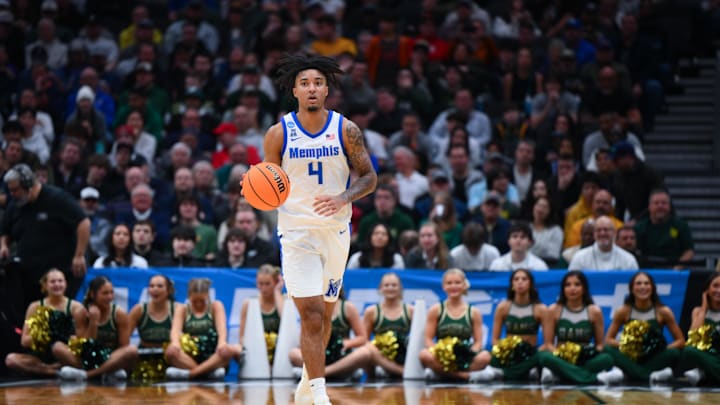 Mar 21, 2025; Seattle, WA, USA; Memphis Tigers guard PJ Haggerty (4) drives the ball during the second half against Colorado State Rams at Climate Pledge Arena. Mandatory Credit: Steven Bisig-Imagn Images