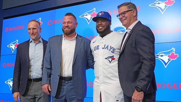 Apr 14, 2025; Toronto, Ontario, Canada; From left to right Toronto Blue Jays President and CEO Mark Shapiro and manager John Schneider and Vladimir Guerrero Jr. and general manager Ross Atkins pose for a photo during the press conference at Rogers Centre. Mandatory Credit: Nick Turchiaro-Imagn Images