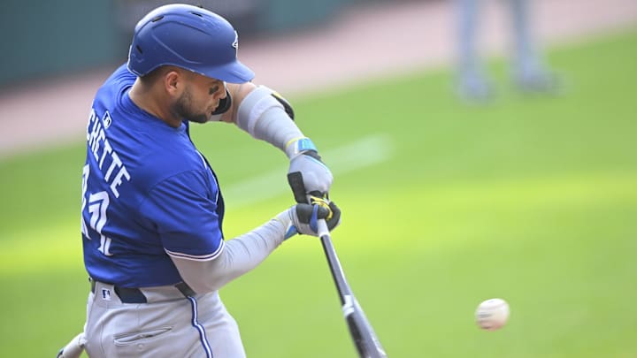 Jun 24, 2025; Cleveland, Ohio, USA; Toronto Blue Jays shortstop Bo Bichette (11) singles in the first inning against the Cleveland Guardians at Progressive Field. 