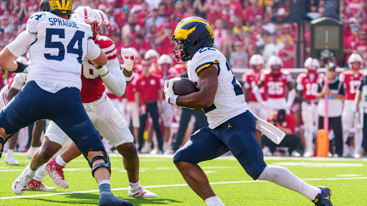 Sep 20, 2025; Lincoln, Nebraska, USA; Michigan Wolverines running back Justice Haynes (22) runs for a touchdown against the Nebraska Cornhuskers during the second quarter at Memorial Stadium. Mandatory Credit: Dylan Widger-Imagn Images