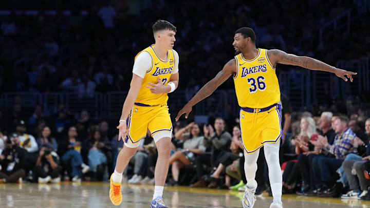 Oct 24, 2025; Los Angeles, California, USA; Los Angeles Lakers forward Jake LaRavia (12) celebrates with guard Marcus Smart (36) after a three-point basket in the first half against the Minnesota Timberwolves at Crypto.com Arena. Mandatory Credit: Kirby Lee-Imagn Images Oct 24, 2025; Los Angeles, California, USA; Los Angeles Lakers forward Jake LaRavia (12) celebrates with guard Marcus Smart (36) after a three-point basket in the first half against the Minnesota Timberwolves at Crypto.com Arena. Mandatory Credit: Kirby Lee-Imagn Images