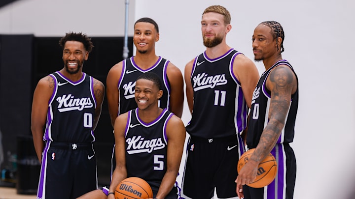 Sep 30, 2024; Sacramento, CA, USA; Sacramento Kings guard Malik Monk (0) and forward Keegan Murray (13) and forward Domantas Sabonis (11) and forward DeMar DeRozan (10) and guard De'Aaron Fox (5) pose for a photo during media day at Golden 1 Center. Mandatory Credit: Sergio Estrada-Imagn Images