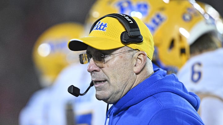 Nov 23, 2024; Louisville, Kentucky, USA;  Pittsburgh Panthers head coach Pat Narduzzi calls a play from the sideline during the second half against the Louisville Cardinals at L&N Federal Credit Union Stadium. Louisville defeated Pittsburgh 37-9. Mandatory Credit: Jamie Rhodes-Imagn Images