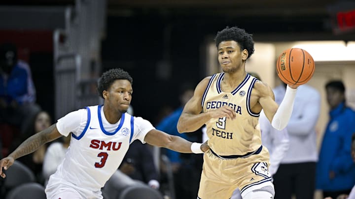 Jan 11, 2025; Dallas, Texas, USA; Georgia Tech Yellow Jackets guard Jaeden Mustaf (3) passes the ball by SMU Mustangs guard Chuck Harris (3) during the first half at Moody Coliseum. Mandatory Credit: Jerome Miron-Imagn Images