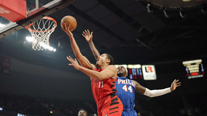 Jan 29, 2024; Portland, Oregon, USA; Portland Trail Blazers point guard Malcolm Brogdon (11) shoots the ball past Philadelphia 76ers small forward Paul Reed (44) during the first half at Moda Center. Mandatory Credit: Soobum Im-Imagn Images Jan 29, 2024; Portland, Oregon, USA; Portland Trail Blazers point guard Malcolm Brogdon (11) shoots the ball past Philadelphia 76ers small forward Paul Reed (44) during the first half at Moda Center. Mandatory Credit: Soobum Im-Imagn Images
