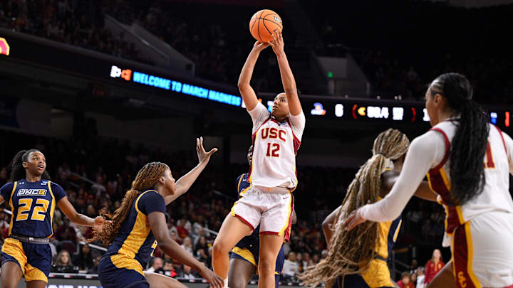 Mar 22, 2025; Los Angeles, California, USA; USC Trojans guard JuJu Watkins (12) shoots over UNC Greensboro Spartans guard Jaila Lee (4) during the second quarter of an NCAA Tournament game at Galen Center. Mandatory Credit: Robert Hanashiro-Imagn Images Mar 22, 2025; Los Angeles, California, USA; USC Trojans guard JuJu Watkins (12) shoots over UNC Greensboro Spartans guard Jaila Lee (4) during the second quarter of an NCAA Tournament game at Galen Center. Mandatory Credit: Robert Hanashiro-Imagn Images