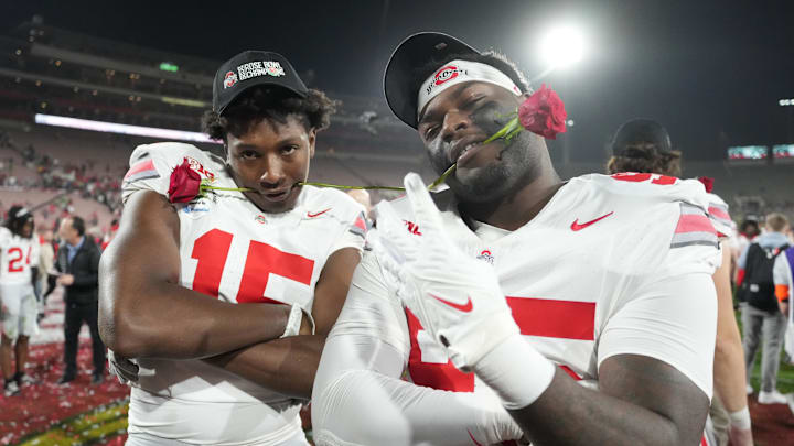 Jan 1, 2025; Pasadena, CA, USA; Ohio State Buckeyes tight end Jelani Thurman (15) and defensive tackle Tywone Malone Jr. (95) celebrate after defeating the Oregon Ducks in the 2025 Rose Bowl college football quarterfinal game at Rose Bowl Stadium. Mandatory Credit: Kirby Lee-Imagn Images