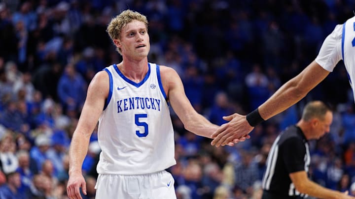 Dec 2, 2025; Lexington, Kentucky, USA; Kentucky Wildcats guard Collin Chandler (5) fives center Malachi Moreno during the first half against the North Carolina Tar Heels at Rupp Arena at Central Bank Center. Mandatory Credit: Jordan Prather-Imagn Images