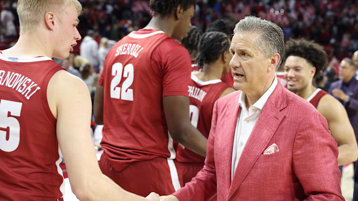 Feb 8, 2025; Fayetteville, Arkansas, USA; Alabama Crimson Tide forward Max Scharnowski (45) shakes hands with Arkansas Razorbacks head coach John Calipari after the game at Bud Walton Arena. Alabama won 85-81. Mandatory Credit: Nelson Chenault-Imagn Images