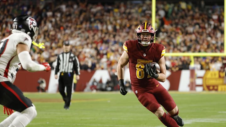 Dec 29, 2024; Landover, Maryland, USA; Washington Commanders tight end John Bates (87) carries the ball as Atlanta Falcons safety Justin Simmons (31) defends during the second half at Northwest Stadium. Mandatory Credit: Amber Searls-Imagn Images Dec 29, 2024; Landover, Maryland, USA; Washington Commanders tight end John Bates (87) carries the ball as Atlanta Falcons safety Justin Simmons (31) defends during the second half at Northwest Stadium. Mandatory Credit: Amber Searls-Imagn Images