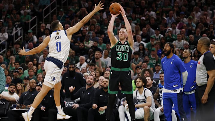 Jun 9, 2024; Boston, Massachusetts, USA; Boston Celtics forward Sam Hauser (30) shoots the ball against Dallas Mavericks guard Dante Exum (0) during the third quarter in game two of the 2024 NBA Finals at TD Garden. Mandatory Credit: Peter Casey-USA TODAY Sports