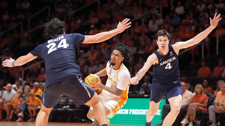 Tennessee guard Terrence Hill Jr. (3) tries to move the ball while defended by Xavier forwards Jovan Milicevic (24) and Filip Borovicanin (4) during a college basketball exhibition game on Oct. 15, 2026, in Knoxville, Tennessee. Tennessee guard Terrence Hill Jr. (3) tries to move the ball while defended by Xavier forwards Jovan Milicevic (24) and Filip Borovicanin (4) during a college basketball exhibition game on Oct. 15, 2026, in Knoxville, Tennessee.