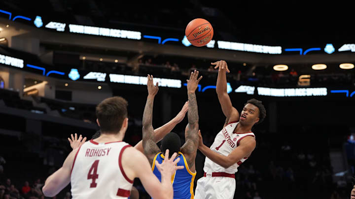 Mar 10, 2026; Charlotte, NC, USA; Stanford Cardinal guard Ebuka Okorie (1) passes the ball to forward AJ Rohosy (4) as Pittsburgh Panthers guard Damarco Minor (7) defends in the second half at Spectrum Center. Mandatory Credit: Bob Donnan-Imagn Images