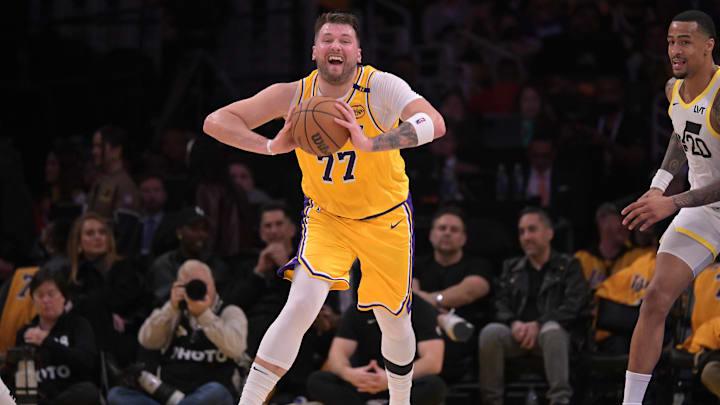 Feb 10, 2025; Los Angeles, California, USA; Los Angeles Lakers guard Luka Doncic (77) looks to make a long pass down court in the first half against the Utah Jazz at Crypto.com Arena. Mandatory Credit: Jayne Kamin-Oncea-Imagn Images