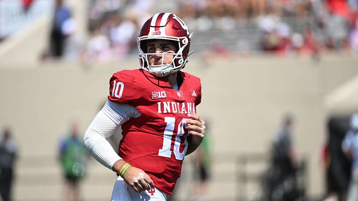 Sep 5, 2026; Bloomington, Indiana, USA; Indiana Hoosiers quarterback Josh Hoover (10) runs onto the field during the fourth quarter against the North Texas Mean Green at Merchants Bank Field at Memorial Stadium. Mandatory Credit: Robert Goddin-Imagn Images Sep 5, 2026; Bloomington, Indiana, USA; Indiana Hoosiers quarterback Josh Hoover (10) runs onto the field during the fourth quarter against the North Texas Mean Green at Merchants Bank Field at Memorial Stadium. Mandatory Credit: Robert Goddin-Imagn Images