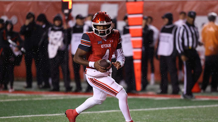 Utah Utes quarterback Devon Dampier (4) runs for a touchdown against the Arizona State Sun Devils during the first quarter at Rice-Eccles Stadium. Utah Utes quarterback Devon Dampier (4) runs for a touchdown against the Arizona State Sun Devils during the first quarter at Rice-Eccles Stadium.