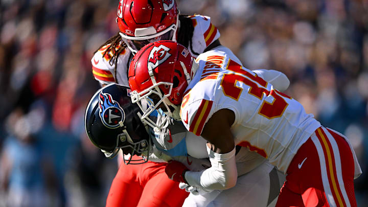 Dec 21, 2025; Nashville, Tennessee, USA; Kansas City Chiefs linebacker Nick Bolton (32) and cornerback Jaylen Watson (35) tackle wide receiver Van Jefferson (11) during the first half at Nissan Stadium. Mandatory Credit: Steve Roberts-Imagn Images Dec 21, 2025; Nashville, Tennessee, USA; Kansas City Chiefs linebacker Nick Bolton (32) and cornerback Jaylen Watson (35) tackle wide receiver Van Jefferson (11) during the first half at Nissan Stadium. Mandatory Credit: Steve Roberts-Imagn Images