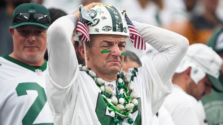 A New York Jets fan looks on during a game between the New York Jets and the Green Bay Packers A New York Jets fan looks on during a game between the New York Jets and the Green Bay Packers