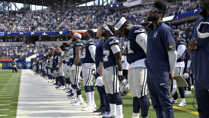 Dallas Cowboys on the sidelines during the National Anthem before the game against the Los Angeles Rams at SoFi Stadium. 