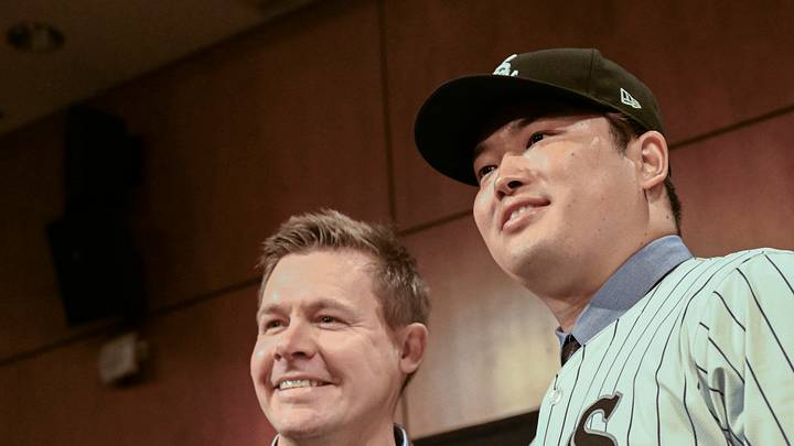 Dec 22, 2025; Chicago, Il, USA;  New Chicago White Sox player Munetaka Murakami, right, dons his hat with General Manager Chris Getz, left,  during a press conference  where he was introduced at Rate Field. Mandatory Credit: Matt Marton-Imagn Images