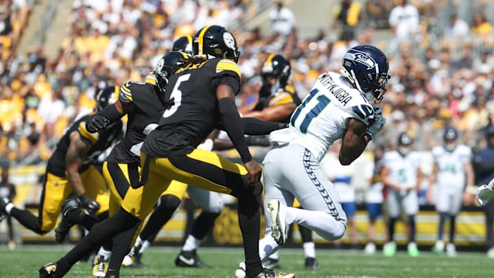 Sep 14, 2025; Pittsburgh, Pennsylvania, USA;  Seattle Seahawks wide receiver Jaxon Smith-Njigba (11) runs after catch against Pittsburgh Steelers cornerback Jalen Ramsey (5) during the first quarter t Acrisure Stadium. Mandatory Credit: Charles LeClaire-Imagn Images