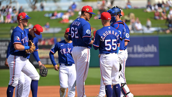 Feb 20, 2026; Surprise, Arizona, USA;  Texas Rangers manager Skip Schumaker (55) stands on the mount as he removes pitcher Robert Garcia (62) in the third inning against the Kansas City Royals at Surprise Stadium. Mandatory Credit: Jayne Kamin-Oncea-Imagn Images