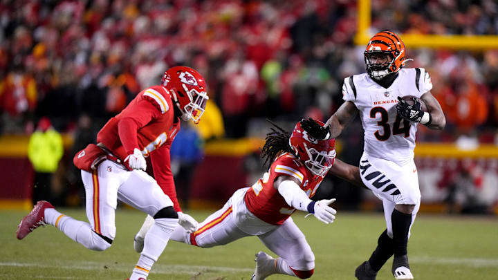 Cincinnati Bengals running back Samaje Perine (34) carries the ball as Kansas City Chiefs safety Ugo Amadi (32) makes the tackle in the second quarter during the AFC championship NFL game between the Cincinnati Bengals and the Kansas City Chiefs, Sunday, Jan. 29, 2023, at GEHA Field at Arrowhead Stadium in Kansas City, Mo. The Kansas City Chiefs lead the Cincinnati Bengals, 13-6, at halftime.

Cincinnati Bengals At Kansas City Chiefs Afc Championship Jan 29 0165
