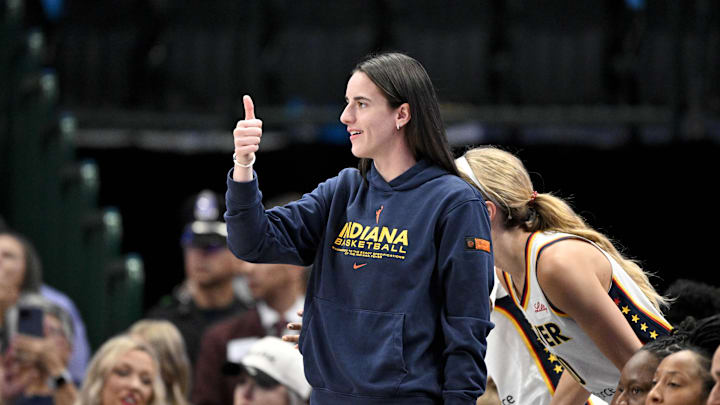 Aug 1, 2025; Dallas, Texas, USA;  Indiana Fever guard Caitlin Clark (22) gives a thumbs up during the first half against the Dallas Wings at the American Airlines Center. Mandatory Credit: Jerome Miron-Imagn Images