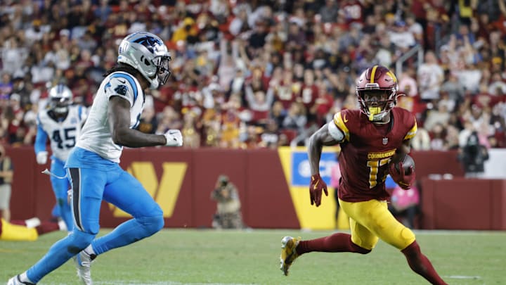 Oct 20, 2024; Landover, Maryland, USA; Washington Commanders wide receiver Terry McLaurin (17) carries the ball as Carolina Panthers cornerback Jaycee Horn (8) defends during the second half at Northwest Stadium. Mandatory Credit: Amber Searls-Imagn Images
