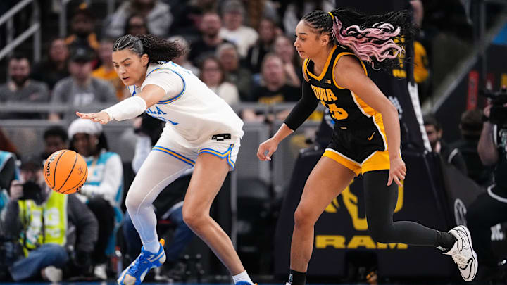 UCLA Bruins center Lauren Betts (51) reaches for the ball against Iowa Hawkeyes forward Hannah Stuelke (45) on Sunday, March 8, 2026, during the Big Ten Tournament Championship game at Gainbridge Fieldhouse in Indianapolis. UCLA Bruins defeated the Iowa Hawkeyes, 96-45, for back to back Big Ten championships. UCLA Bruins center Lauren Betts (51) reaches for the ball against Iowa Hawkeyes forward Hannah Stuelke (45) on Sunday, March 8, 2026, during the Big Ten Tournament Championship game at Gainbridge Fieldhouse in Indianapolis. UCLA Bruins defeated the Iowa Hawkeyes, 96-45, for back to back Big Ten championships.