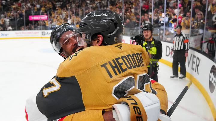 Jun 6, 2026; Las Vegas, Nevada, USA; Vegas Golden Knights defenseman Shea Theodore (27) celebrates with right wing Keegan Kolesar (55) after scoring a goal against the Carolina Hurricanes during the second overtime in game three of the 2026 Stanley Cup Final at T-Mobile Arena. Mandatory Credit: Stephen R. Sylvanie-Imagn Images