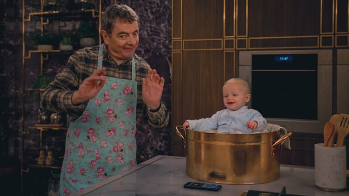 (L to R) Rowan Atkinson as Trevor Bingley, Baby Jesus, in Man Vs Baby (L to R) Rowan Atkinson as Trevor Bingley, Baby Jesus, in Man Vs Baby